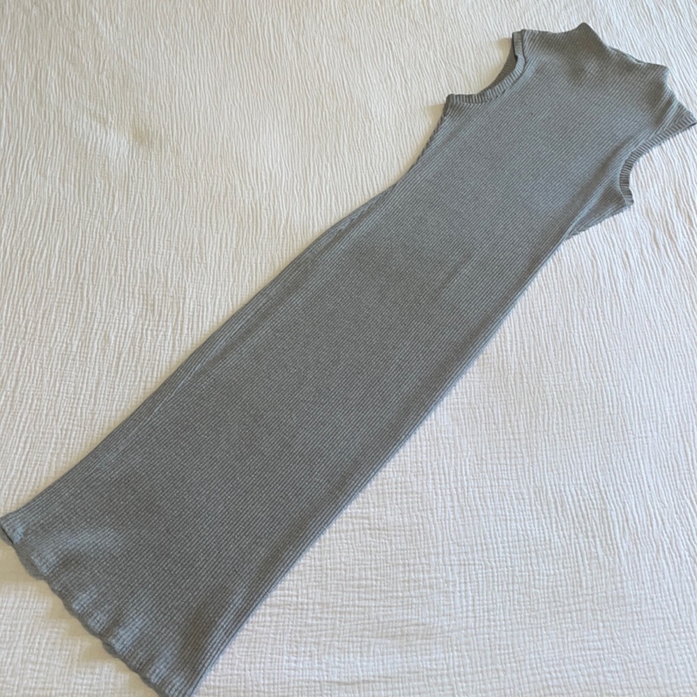 A beautiful ribbed heather-grey sleeveless dress with mock neck.